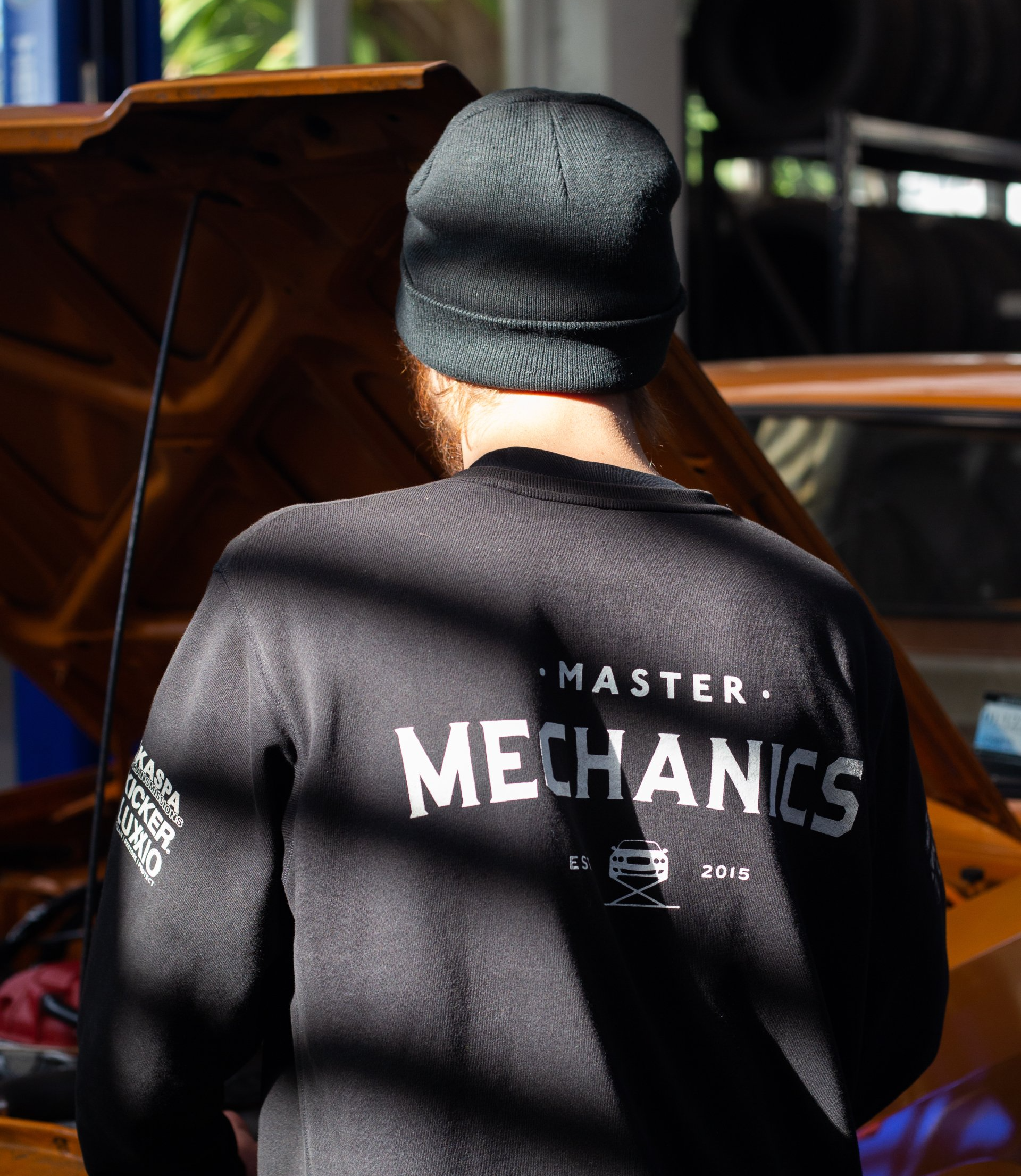 Master Mechanics branded mechanic working on a vehicle